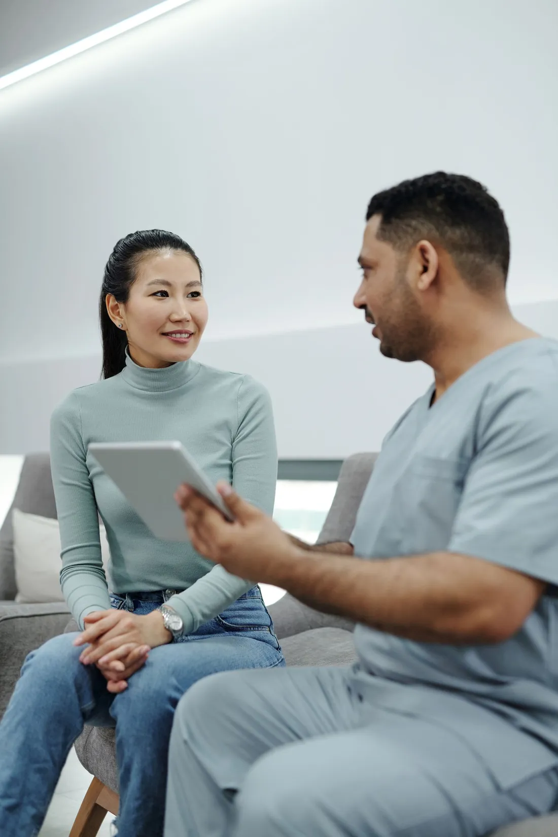 Woman talking with a doctor about waking up sweating every night